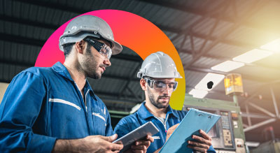 Two men in a steel warehouse working